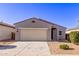 Charming one-story home featuring a two-car garage, low maintenance desert landscaping, and a neutral color palette at 45722 W Sky Ln, Maricopa, AZ 85139