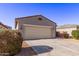 Charming one-story home with desert landscaping and a two-car garage with a large driveway at 45722 W Sky Ln, Maricopa, AZ 85139