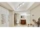 Bathroom with a vanity, toilet, tiled walk-in shower, and decorative bi-fold closet doors at 5111 N 83Rd St, Scottsdale, AZ 85250