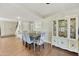Dining room featuring hardwood floors, colorful chairs, and an elegant china cabinet at 5111 N 83Rd St, Scottsdale, AZ 85250