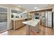 Bright kitchen featuring granite countertops, stainless steel appliances, and an island with seating at 5111 N 83Rd St, Scottsdale, AZ 85250