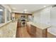 Kitchen featuring granite countertops, stainless steel appliances, and an island with breakfast bar at 5111 N 83Rd St, Scottsdale, AZ 85250