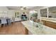 Open concept space featuring granite countertops, stainless steel appliances, and a view into the dining area at 5111 N 83Rd St, Scottsdale, AZ 85250