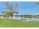 Picturesque lake view featuring a lakeside bench and picnic table in a peaceful setting at 5111 N 83Rd St, Scottsdale, AZ 85250