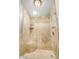 Elegant glass-enclosed shower with a seat and neutral tiling enhances the bathroom's spa-like ambiance at 529 E Taro Ln, Phoenix, AZ 85024