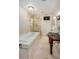Elegant bathroom features a soaking tub, glass shower, vanity, and modern fixtures at 529 E Taro Ln, Phoenix, AZ 85024