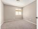 Carpeted bedroom with a window provides a comfortable space for relaxation at 529 E Taro Ln, Phoenix, AZ 85024