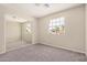Bright bedroom with large window and mirrored closet offers ample space and natural light at 529 E Taro Ln, Phoenix, AZ 85024