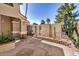 Charming courtyard with stone pavers, stucco walls, wrought iron accents and desert plants at 529 E Taro Ln, Phoenix, AZ 85024