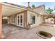 Charming home exterior featuring a covered patio, manicured garden, and stone accents at 529 E Taro Ln, Phoenix, AZ 85024