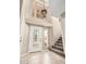 Bright foyer features tiled floors, stairway, chandelier, and decorative glass front door at 529 E Taro Ln, Phoenix, AZ 85024