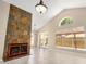 Spacious living room with high ceilings, modern fireplace, and large windows providing natural light at 529 E Taro Ln, Phoenix, AZ 85024