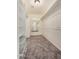 Carpeted walk-in closet with ample shelving, creating organized storage for all your wardrobe needs at 529 E Taro Ln, Phoenix, AZ 85024