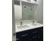 Contemporary bathroom with a double sink vanity, sleek fixtures, and a glass-enclosed shower at 540 E Royal Palms Dr, Mesa, AZ 85203