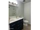 Modern bathroom showcasing a double sink vanity, white countertops, and a glass-enclosed shower at 540 E Royal Palms Dr, Mesa, AZ 85203