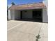 Attached carport showing concrete driveway, stucco siding, and clay tile roof at 540 E Royal Palms Dr, Mesa, AZ 85203