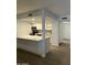 Well-lit modern kitchen with new stainless appliances, quartz countertops, and ample storage space at 540 E Royal Palms Dr, Mesa, AZ 85203