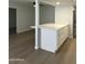 Kitchen features white cabinets, stainless steel refrigerator, and durable countertops at 540 E Royal Palms Dr, Mesa, AZ 85203