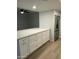 Kitchen features white cabinets, stainless steel refrigerator, and durable countertops at 540 E Royal Palms Dr, Mesa, AZ 85203