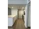 Stylish kitchen features stainless steel appliances, white cabinets, and durable countertops at 540 E Royal Palms Dr, Mesa, AZ 85203