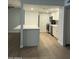 Charming kitchen features stainless steel appliances, white cabinets, and durable countertops at 540 E Royal Palms Dr, Mesa, AZ 85203