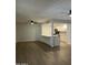 Spacious living room with ceiling fans and luxury vinyl plank flooring, adjacent to kitchen at 540 E Royal Palms Dr, Mesa, AZ 85203