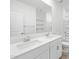 Bathroom showcasing a double sink vanity, a large mirror, and an enclosed shower at 5549 S 246Th Ave, Buckeye, AZ 85326