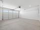 Clean, spacious garage with a large garage door, ready for vehicles and storage at 5549 S 246Th Ave, Buckeye, AZ 85326
