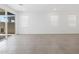 Bright living room features tile flooring, sliding glass door, and three windows at 5549 S 246Th Ave, Buckeye, AZ 85326