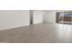 Open-concept living space with tile flooring and sliding glass doors to outdoor area at 5549 S 246Th Ave, Buckeye, AZ 85326