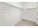 Bright walk-in closet with shelving and neutral carpet providing ample storage space at 5549 S 246Th Ave, Buckeye, AZ 85326
