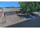 An aerial view shows the home's location and access to a large driveway and a two-car garage at 5932 E Colby St, Mesa, AZ 85205