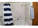 Bathtub and shower with tile surround and new fixtures at 5932 E Colby St, Mesa, AZ 85205