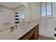 Bathroom features a large mirror, neutral countertop, and a shower/tub combination at 5932 E Colby St, Mesa, AZ 85205