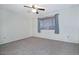 Neutral bedroom with carpet and window overlooking the backyard at 5932 E Colby St, Mesa, AZ 85205