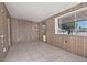 Bonus room featuring wood paneling, natural light and tile floors at 5932 E Colby St, Mesa, AZ 85205