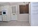 The dining area includes tile flooring and a view of the backyard through the windows at 5932 E Colby St, Mesa, AZ 85205