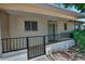Covered front porch protected by railing, providing a cozy, welcoming entrance at 5932 E Colby St, Mesa, AZ 85205