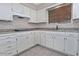 Bright kitchen featuring white cabinetry, granite counters and subway tile backsplash at 5932 E Colby St, Mesa, AZ 85205