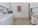 Well-equipped laundry room with a washer, dryer, and ample space for laundry tasks at 5932 E Colby St, Mesa, AZ 85205