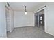 Carpeted living room with sliding glass doors to the backyard, providing ample natural light at 5932 E Colby St, Mesa, AZ 85205