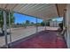 Inviting covered patio with seating, perfect for relaxing and enjoying the outdoor view at 5932 E Colby St, Mesa, AZ 85205
