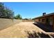 Spacious backyard featuring a covered patio and privacy wall perfect for entertaining or relaxing outdoors at 6504 W Cochise Dr, Glendale, AZ 85302