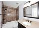 Bathroom with a shower and tub combo with a matching vanity at 6504 W Cochise Dr, Glendale, AZ 85302