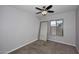 Simple bedroom with neutral walls, carpet and view to the backyard at 6504 W Cochise Dr, Glendale, AZ 85302