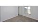Cozy bedroom featuring neutral paint, carpet and a bright window at 6504 W Cochise Dr, Glendale, AZ 85302