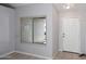 Cozy entryway with large window and a white front door at 6504 W Cochise Dr, Glendale, AZ 85302
