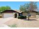 Attractive single-story home with brick exterior, and a well-maintained front yard at 6504 W Cochise Dr, Glendale, AZ 85302