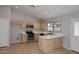 Well-lit kitchen with stainless appliances, white countertops, and an open layout at 6504 W Cochise Dr, Glendale, AZ 85302