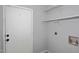 Laundry room has a door to the outside and is complete with shelving and hookups at 6504 W Cochise Dr, Glendale, AZ 85302